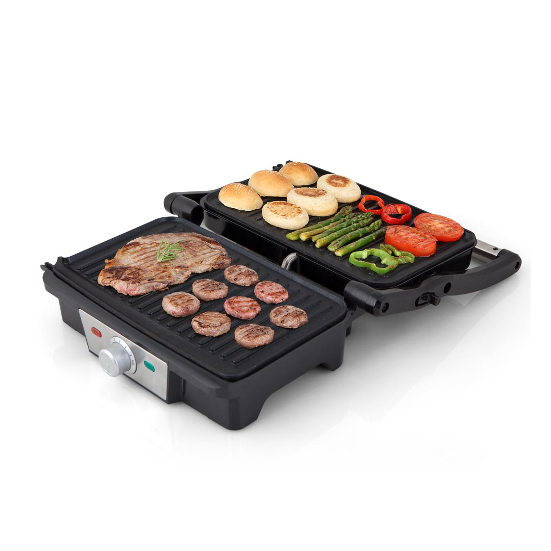 Imagen del grill GR-3800 de Orbegozo en uso, mostrando su capacidad para cocinar alimentos de manera eficiente y uniforme a 180 grados, disponible en Electrocash