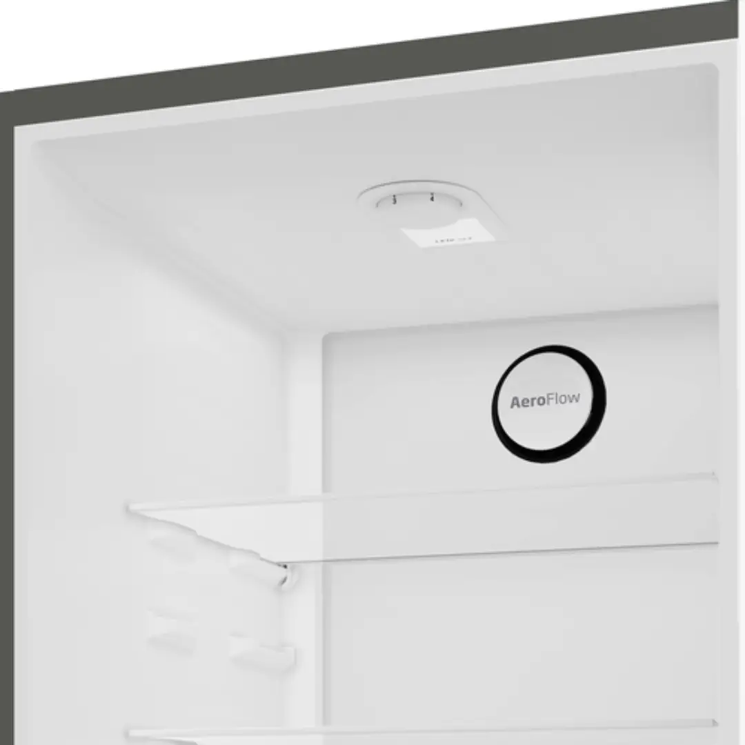 Vista del compartimento superior del combi inox Beko B1RCNE-364G, destacando los estantes y el compartimiento del congelador