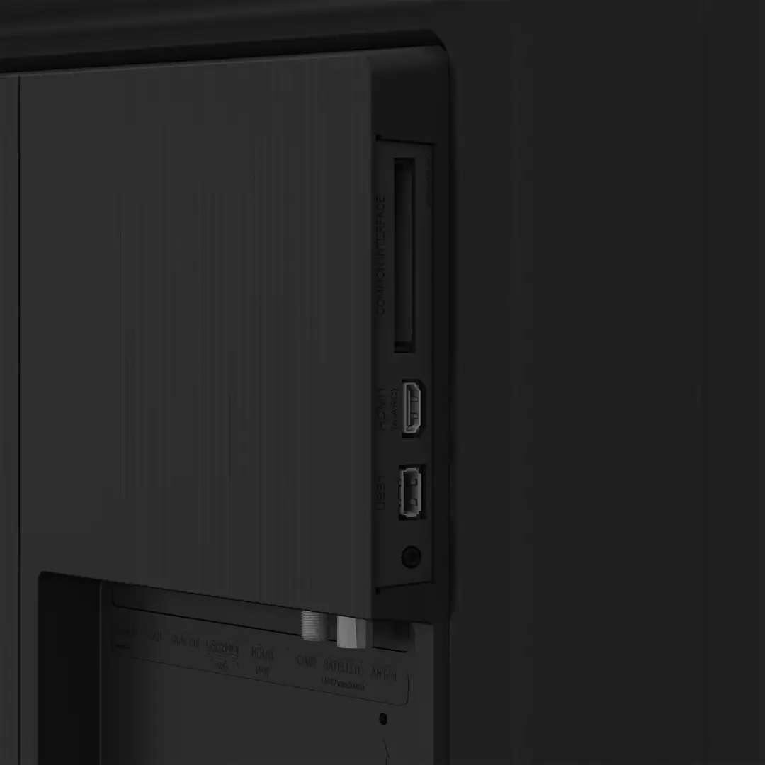 Detalle de los conectores laterales del televisor QLED Grundig 65GIQ-8900 B de 65", con acceso fácil a las conexiones