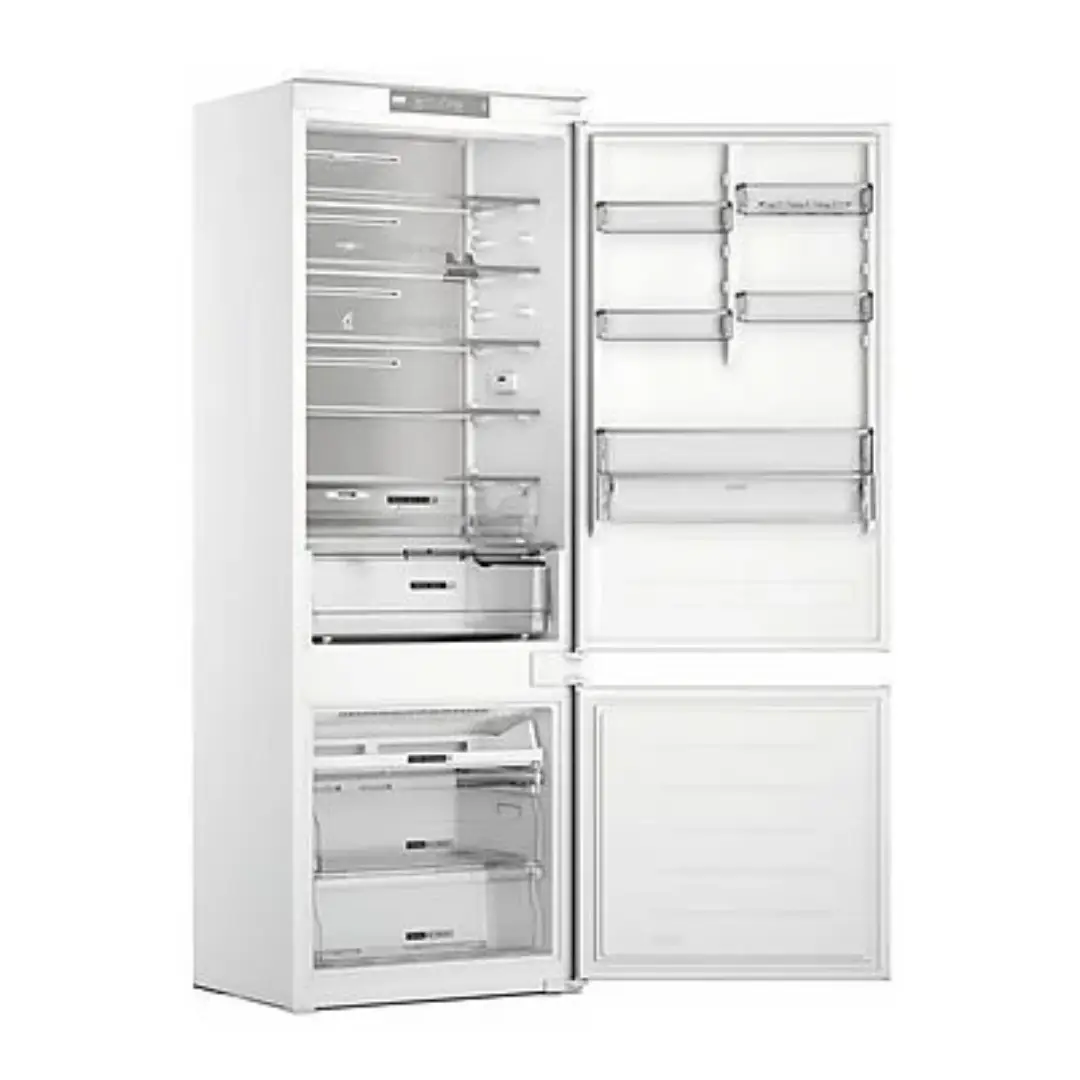 Vista lateral del interior del frigorífico combi Whirlpool WH-SP70 T121 abierto, mostrando los estantes, cajones y compartimentos amplios para una organización eficiente — disponible en Electrocash.