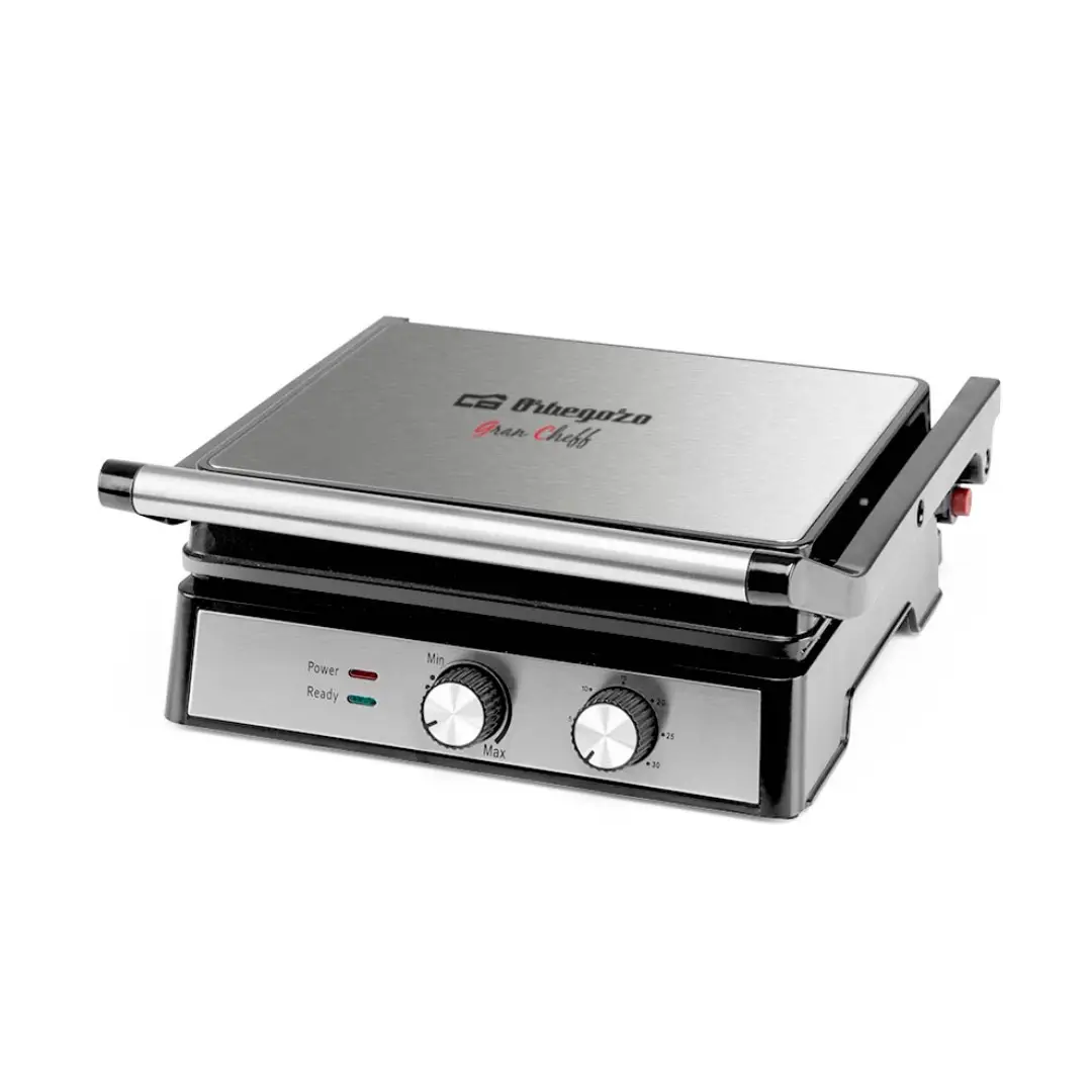 Imagen principal del grill Orbegozo GR-4580 en acero inoxidable, con potencia de 2000W y diseño compacto ideal para preparar carnes, sándwiches y verduras a la plancha.